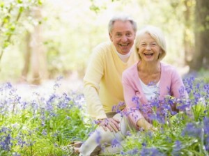 Senior couple in bluebell woods